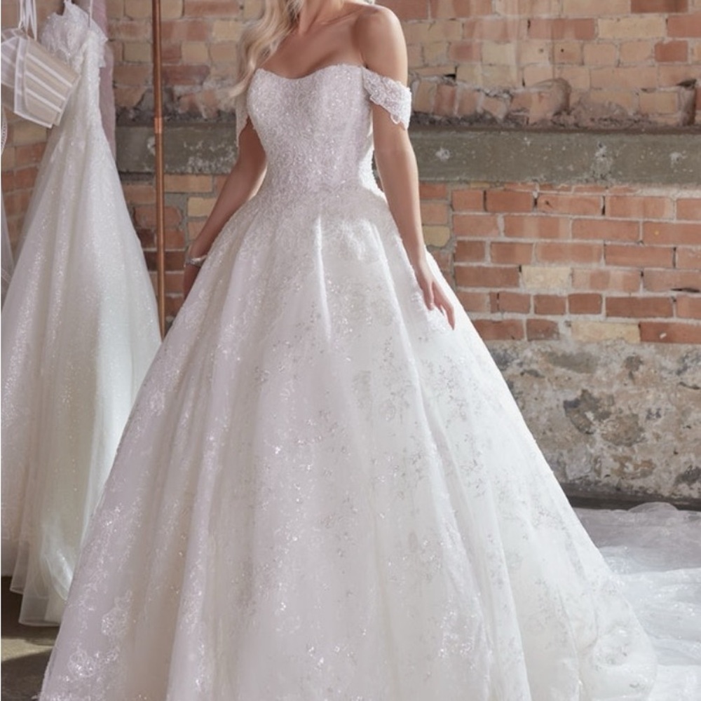 Elegant Maggie Sottero strapless ballgown with beaded bodice. Classic style